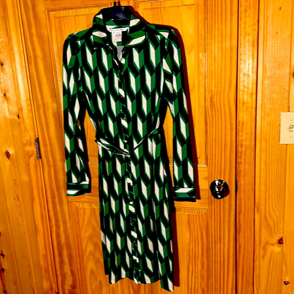 Women’s size 6, dress with long sleeves and geometrical design, multiple colors.
